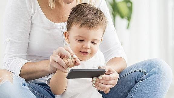 Baby and mom playing with iPad