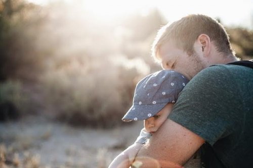 Father holding son