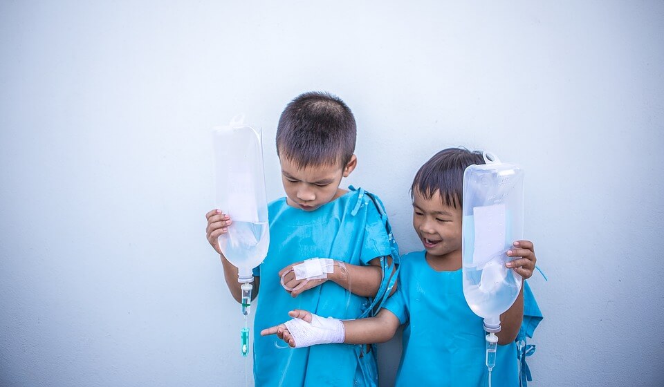 Two children getting medical treatment