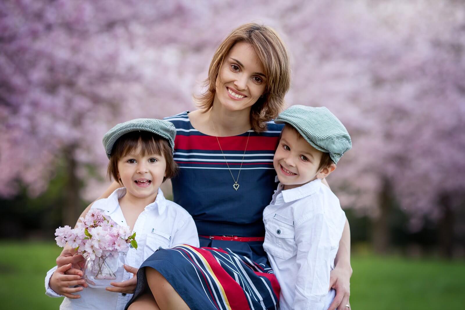 Mother holding two children