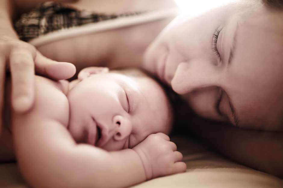 mother sleeping with child