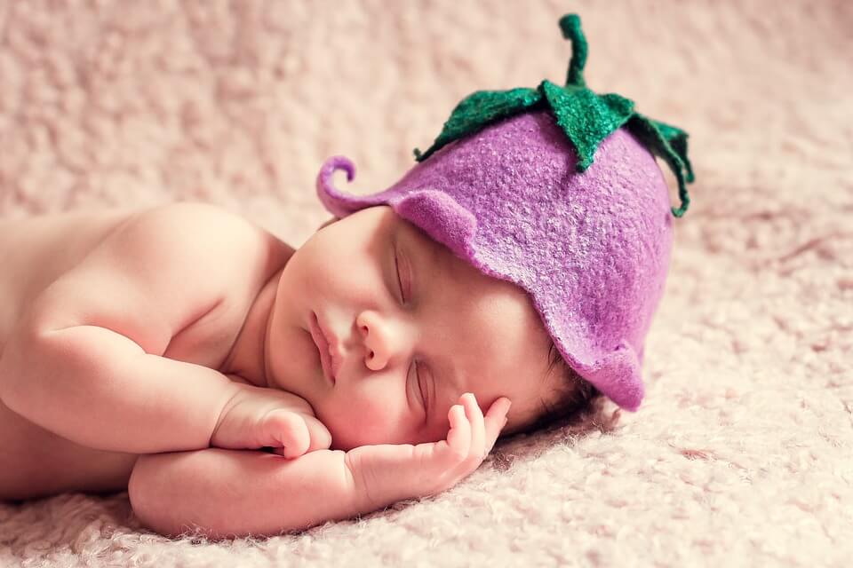 Baby sleeping with cute hat on