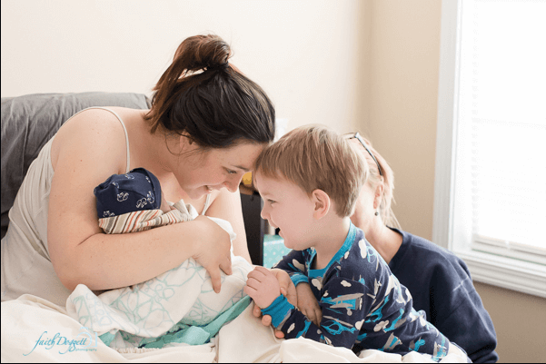 Mother and child and baby in hospital bed