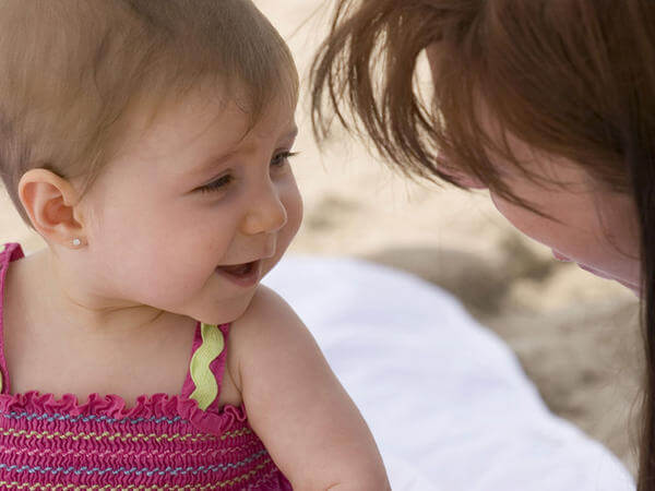 Baby smiling at mom