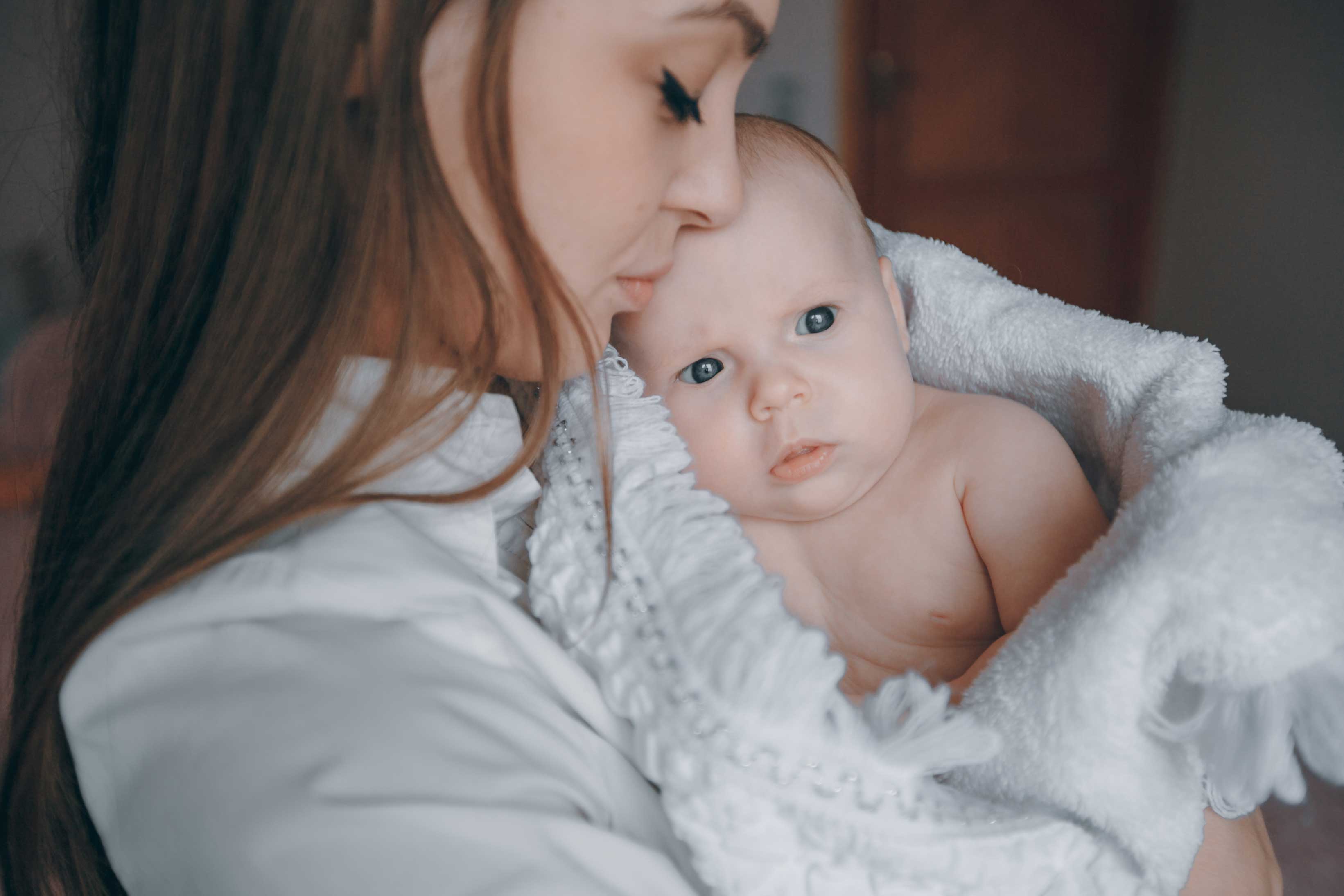 mom holding baby in her arms