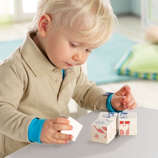 two-year-old boy playing with blocks