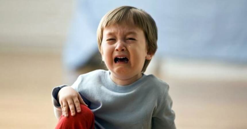 boy crying after hitting his head