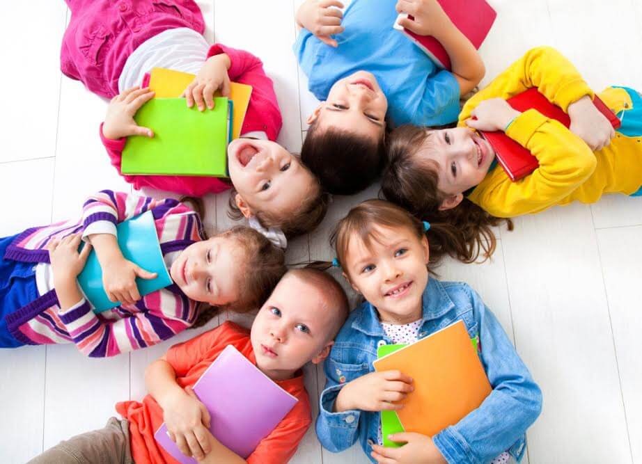 Group of kids with books in their hands