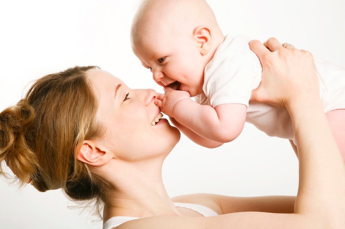 mom holding baby