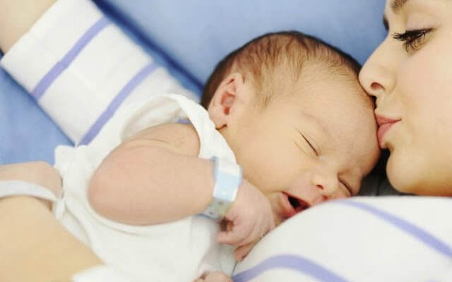 Brunette mother postpartum