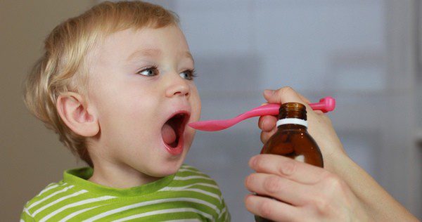 Boy taking his medicine