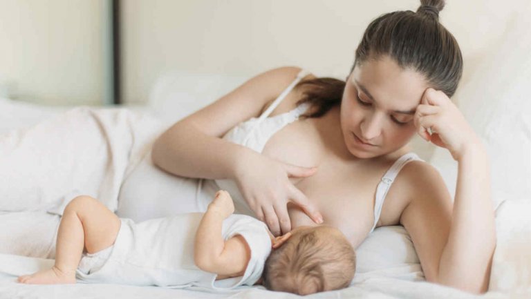 mother breastfeeding child