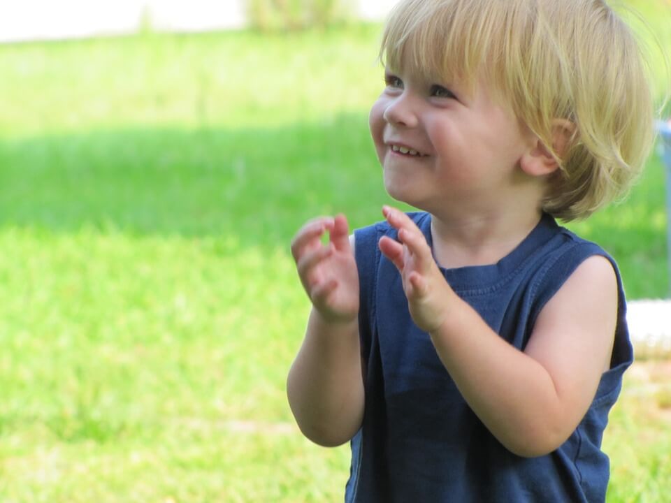 happy baby clapping hands
