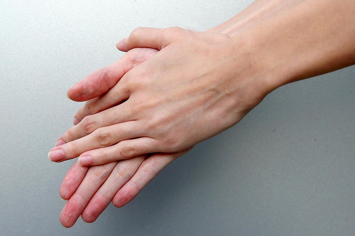 rubbing palm of hands together