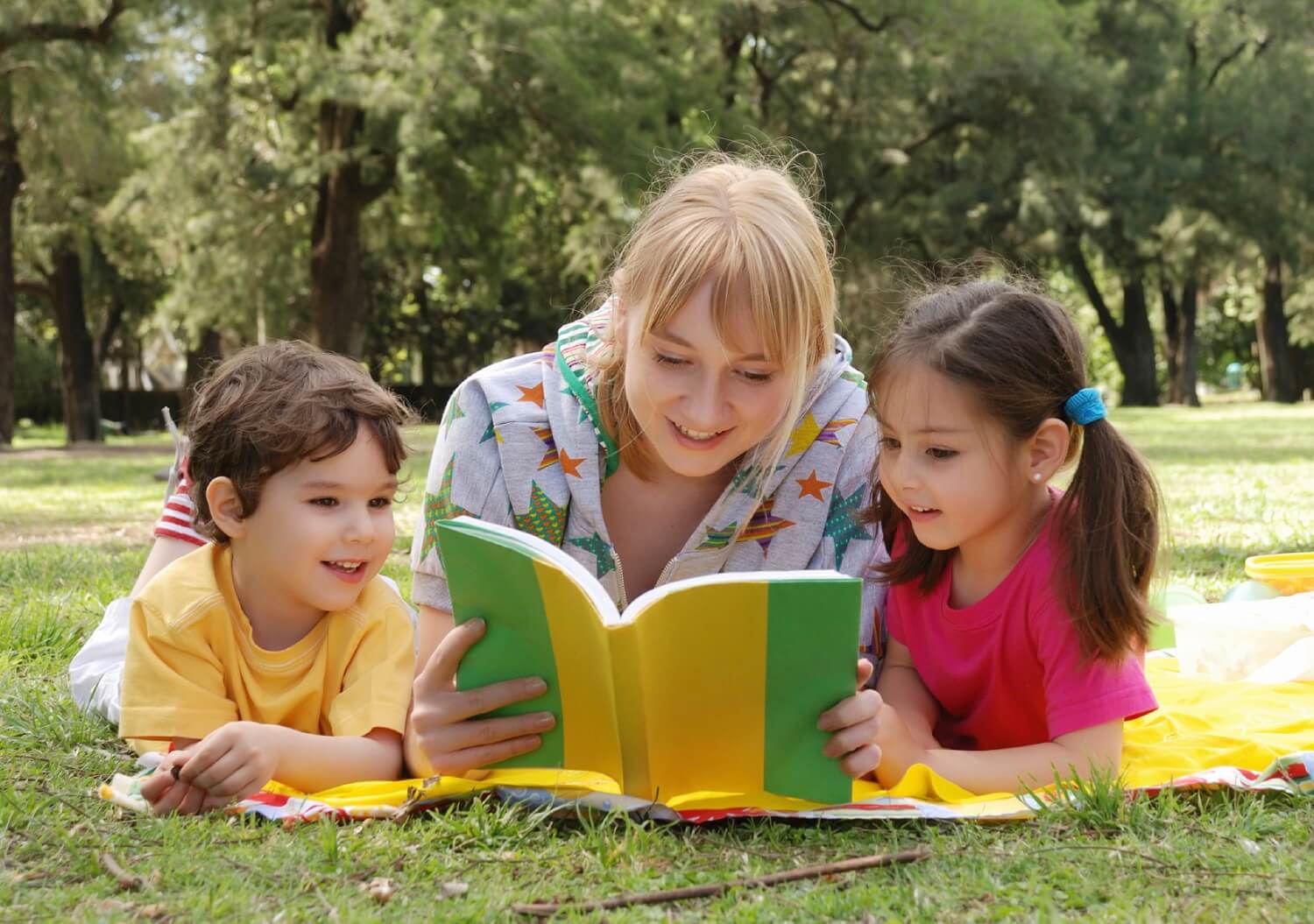 Mother reading books with children