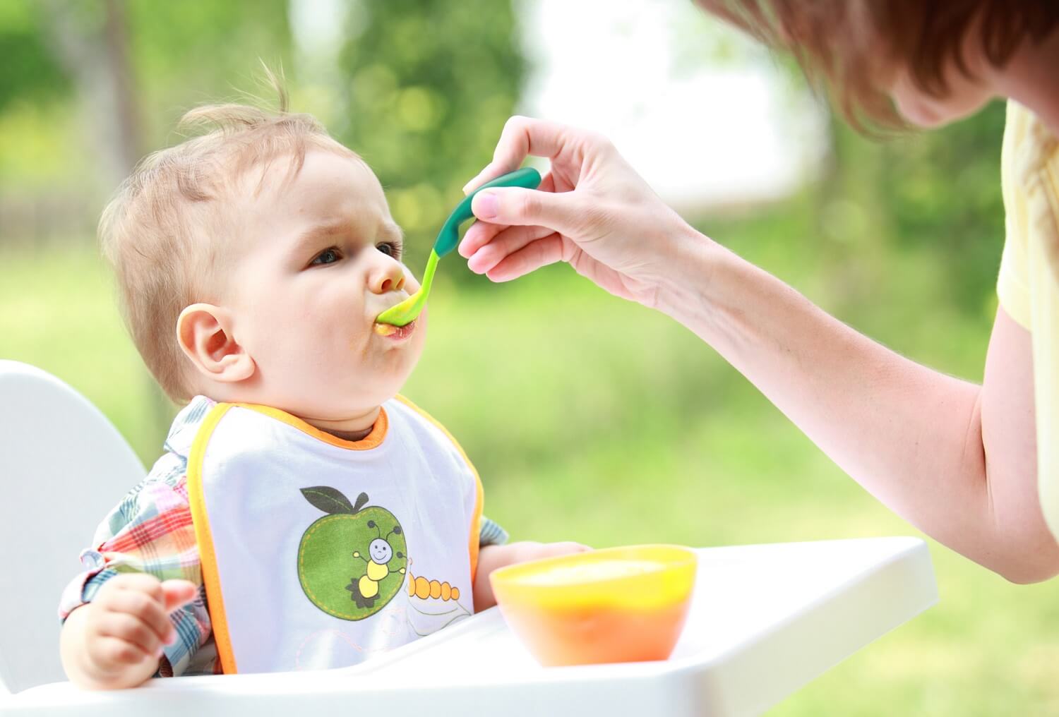feeding a complimentary diet to a baby