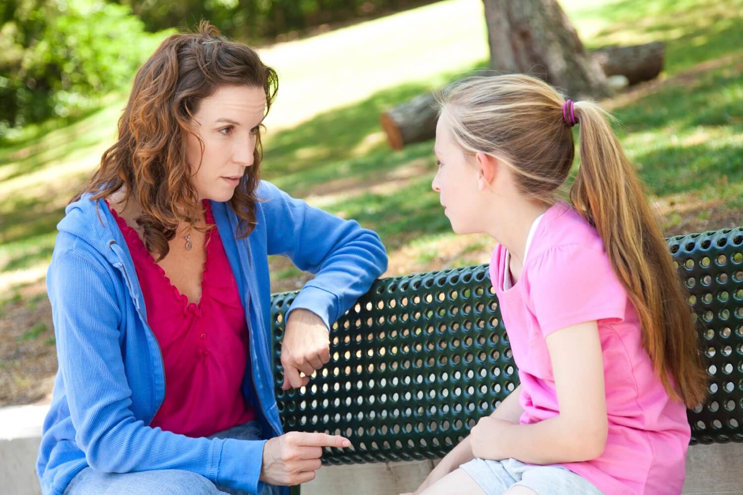 a mother talking to her daughter about strangers