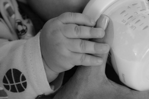 feeding breast milk to a baby