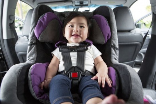 girl sitting in a car seat