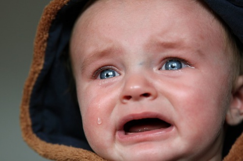 blue eyed baby crying