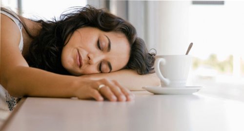 exhausted mother in the morning with a coffee