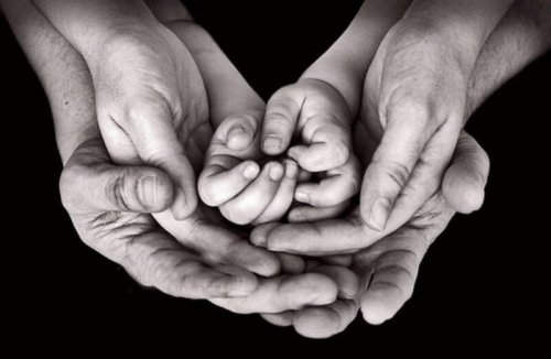 three pairs of hands black and white photo
