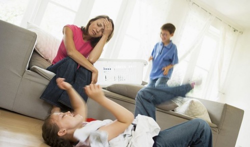 exhausted full-time mom with her two boys