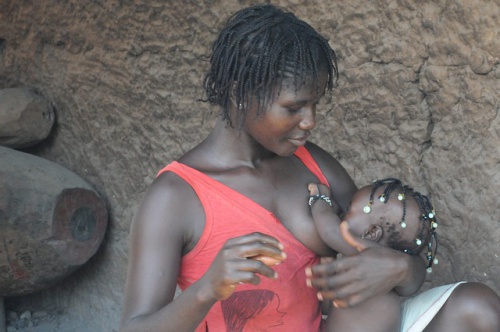 woman breastfeeding her baby