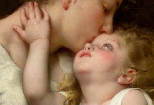 mom kissing baby