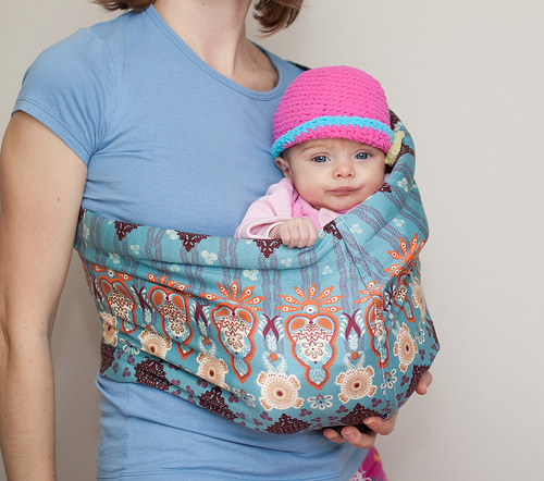 Mother carrying daughter, maternal instinct