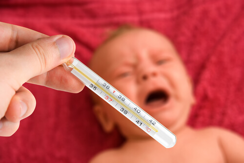baby crying with a fever