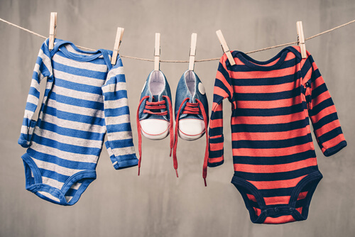 babies clothes and shoes hanging up