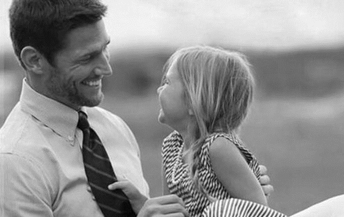 black and white photo of a father and daughter
