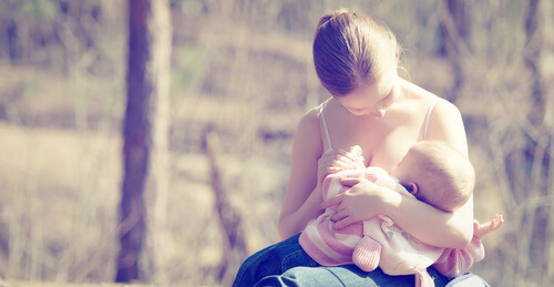 mother breastfeeding her newborn baby