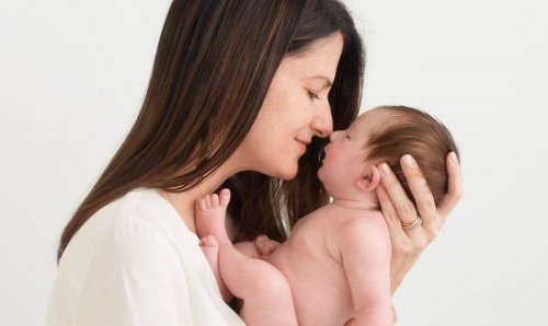 mom holding baby
