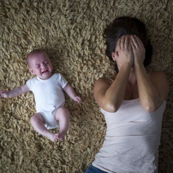 mom suffering from postpartum depression with baby