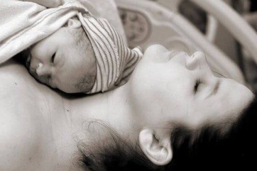 black and white photo of mother and baby