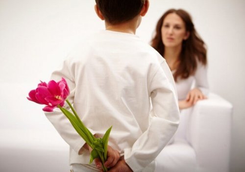 father giving a bouquet of flowers to mother
