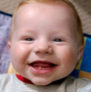 6 Signs Your Baby's First Tooth is Emerging