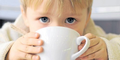 Coffee and children, boy drinking coffee