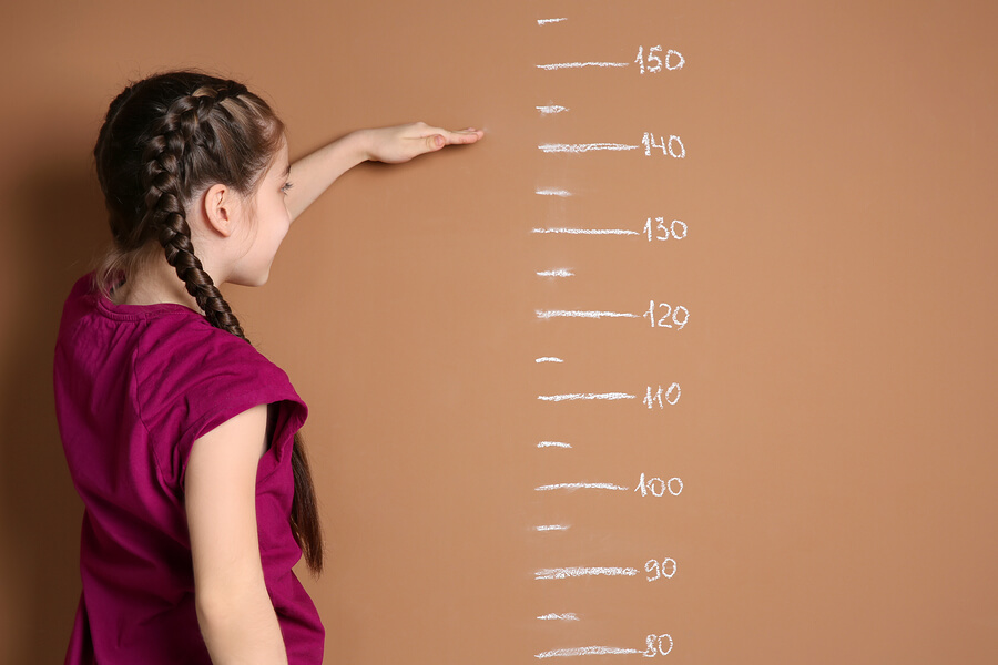  A girl measuring her height.