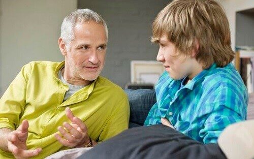 Father talking to teenage son