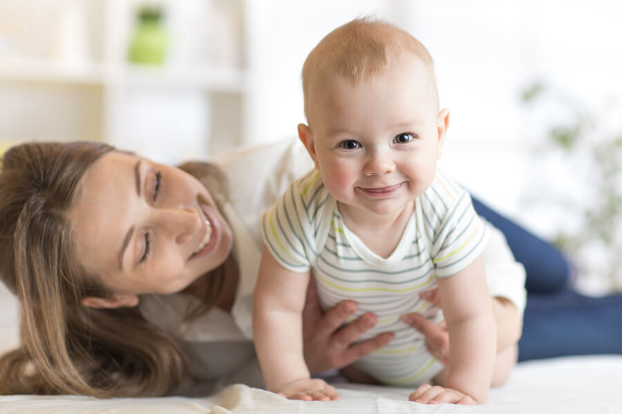 smiling mom and baby