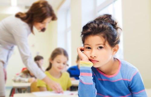 A child looking ambivalent during class.