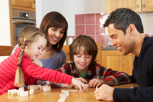 family playing dominoes
