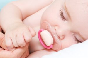 baby sleeping with pacifier