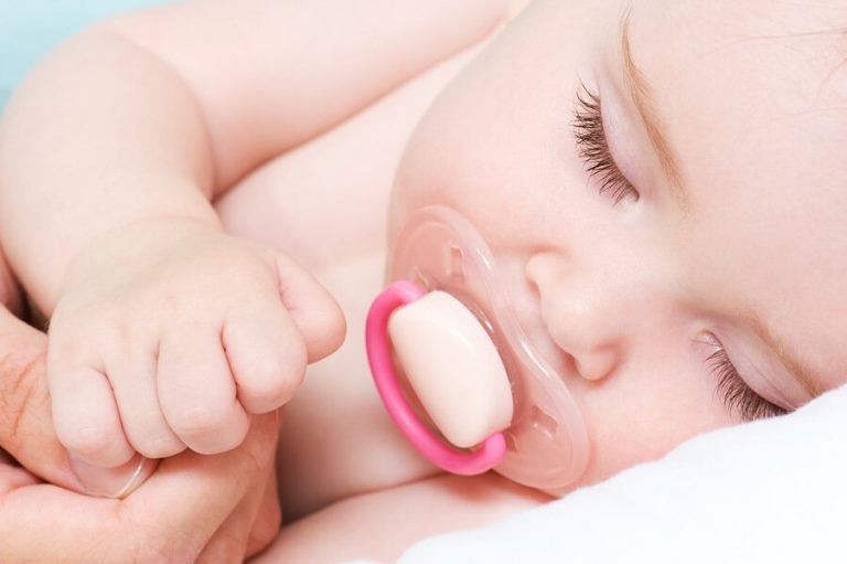 newborn sleeping with pacifier