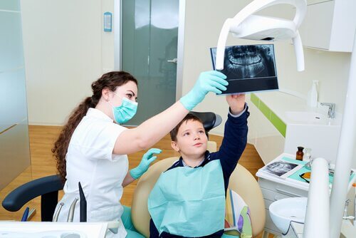Boy at a checkup for his braces.