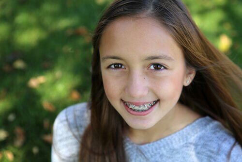 Girl with braces smiling.