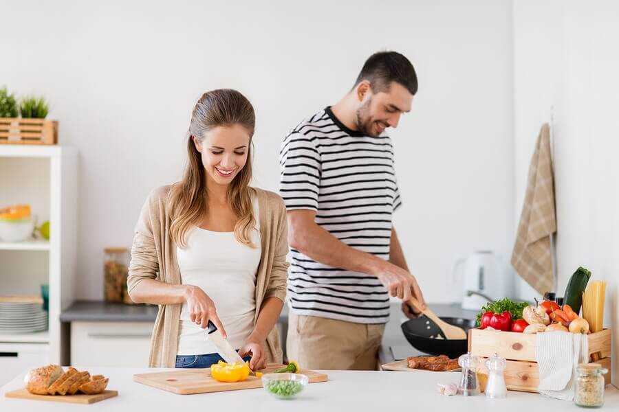 couple making dinner cooking together